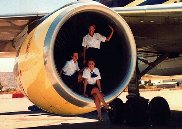 3 flight attendants in an aircraft engine