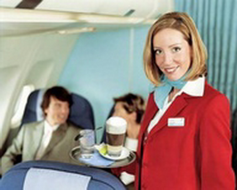 flight attendant serving drinks