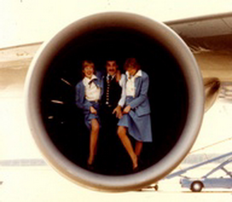 flight attendants and pilot in aircraft engine