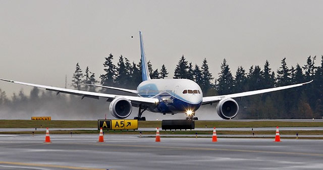 787 rolls down runway toward its first takeoff