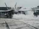 f-18 hornet being launched from an aircraft carrier