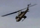 Cobra gunship helicopter taking out targets in iraq